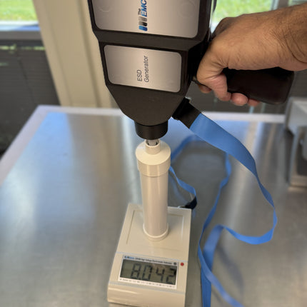 ESVM High Voltage Electrostatic Voltmeter measuring ESD generator output at 8042V for voltage verification in electrostatic discharge testing.