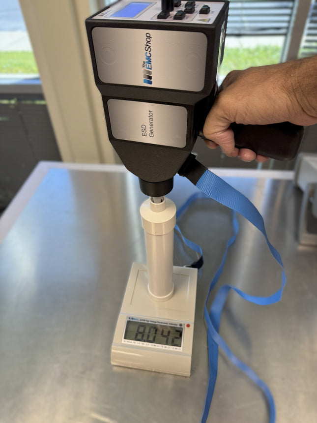 ESVM High Voltage Electrostatic Voltmeter measuring ESD generator output at 8042V for voltage verification in electrostatic discharge testing.