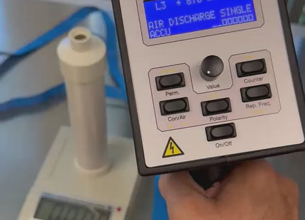ESVM High Voltage Electrostatic Voltmeter displaying 8.0 kV for ESD generator voltage verification in a lab setup with digital readout.