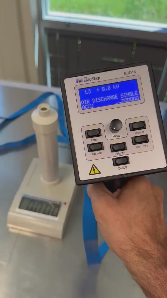 ESVM High Voltage Electrostatic Voltmeter displaying 8.0 kV for ESD generator voltage verification in a lab setup with digital readout.