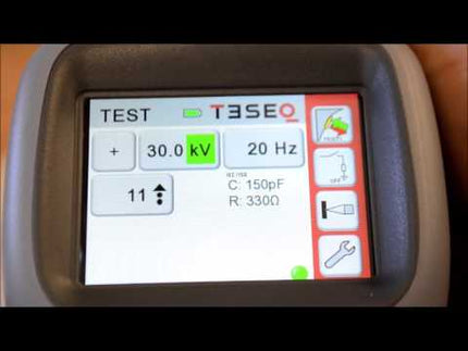 Close-up of Teseq NSG 438 30kV ESD Simulator Gun digital display showing voltage and resistance settings for precise ESD testing control.