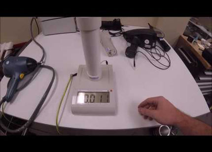 ESVM High Voltage Electrostatic Voltmeter displaying 0.01 kV during ESD generator voltage verification on a lab workbench. Ideal for precise electrostatic discharge testing.